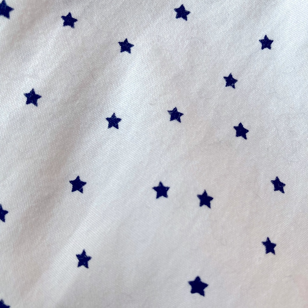 Dress shirt with navy star pattern.